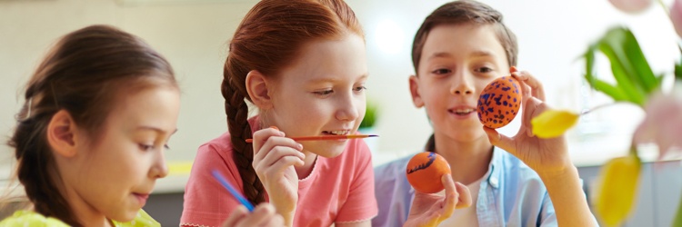 Kids painting easter eggs