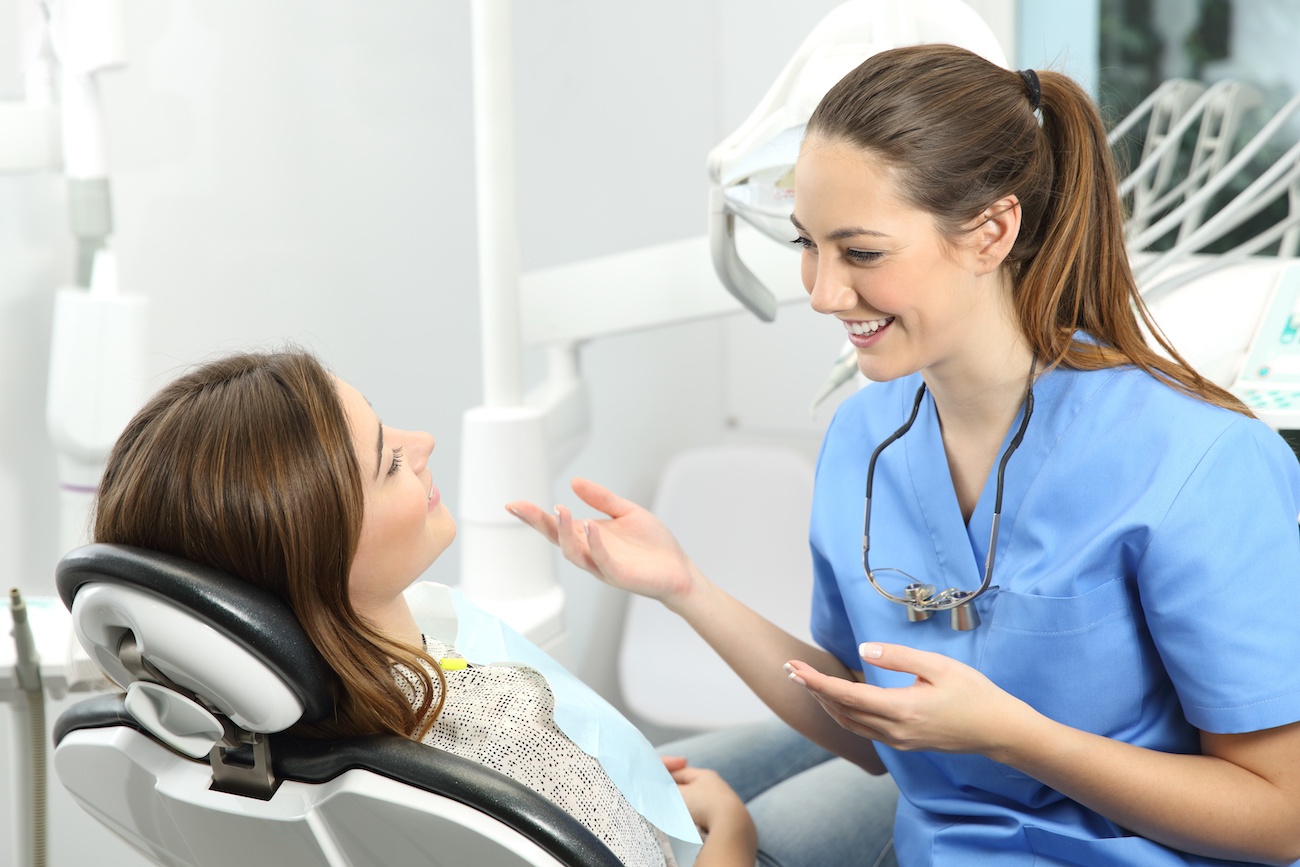 Dentist explaining procedure to a patient